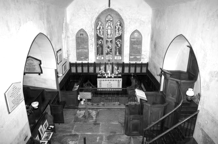 The interior of Ynyscynhaearn Church looking down on the altar