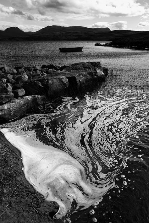 Foam at the edge of the loch, photographed at the end of the day