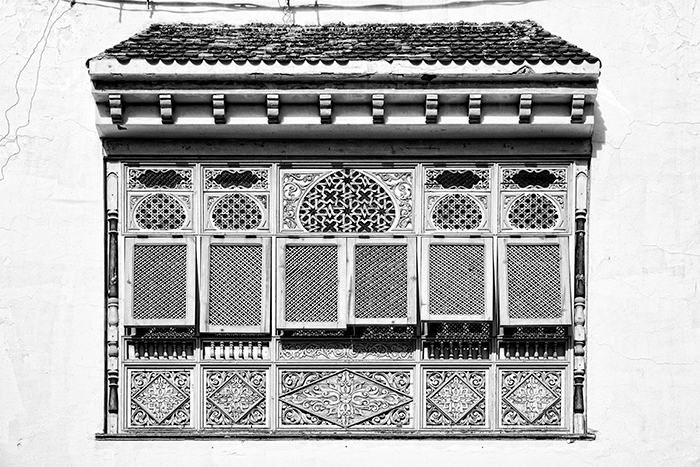 A traditional Tunisian carved wooden window in the small town of Mahdia