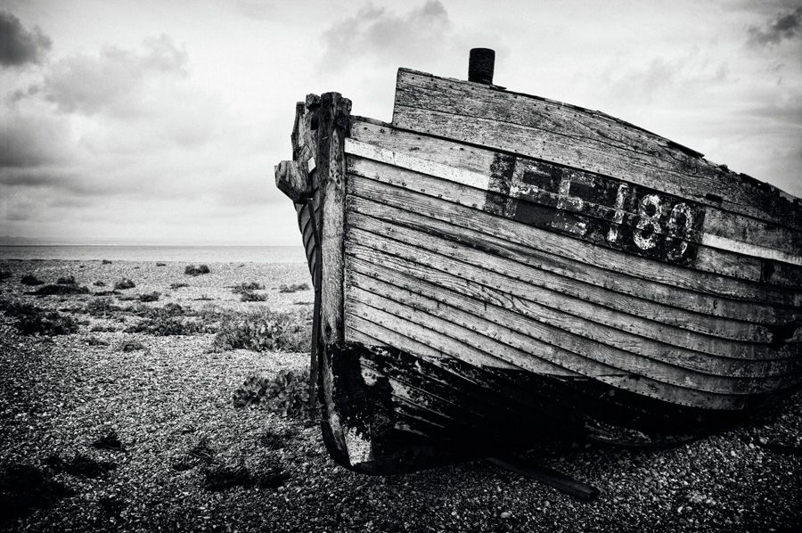 eng0039bw15x10pnewcom-orig_orig The bow of a decaying fishing boat sitting on the shingle beach at Dungeness